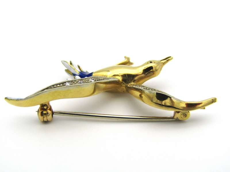 18K gold diamond and enamel "Bird in flight" brooch.