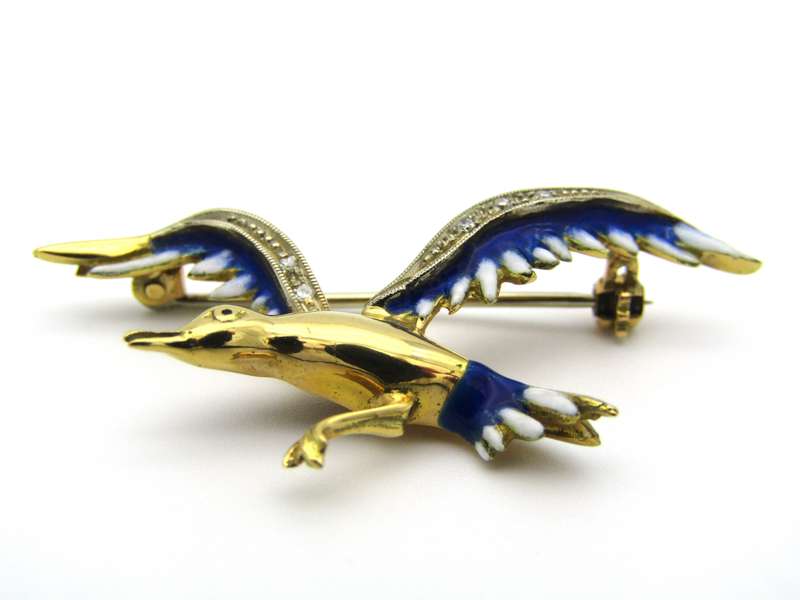 18K gold diamond and enamel "Bird in flight" brooch.
