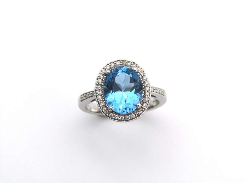 14K gold blue topaz and diamond ring.