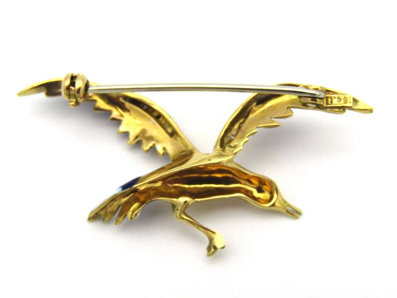 18K gold diamond and enamel "Bird in flight" brooch.