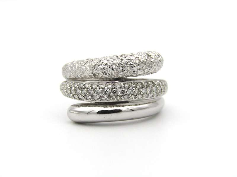 9K gold diamond swirl ring.