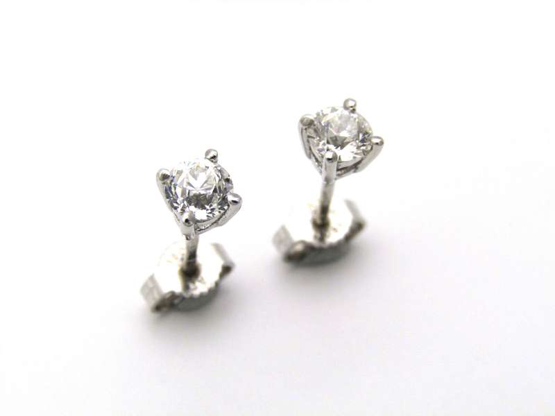 A pair of 18K gold diamond studs.