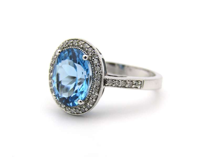 14K gold blue topaz and diamond ring.