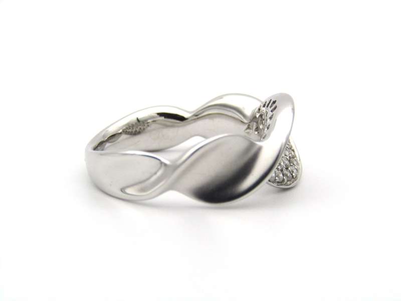 18K gold twist diamond ring.