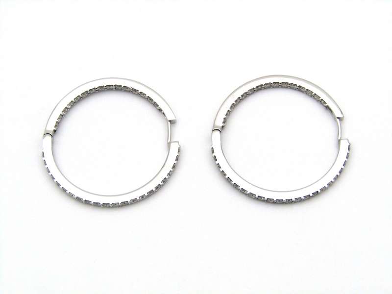 18K gold diamond hoop earrings.
