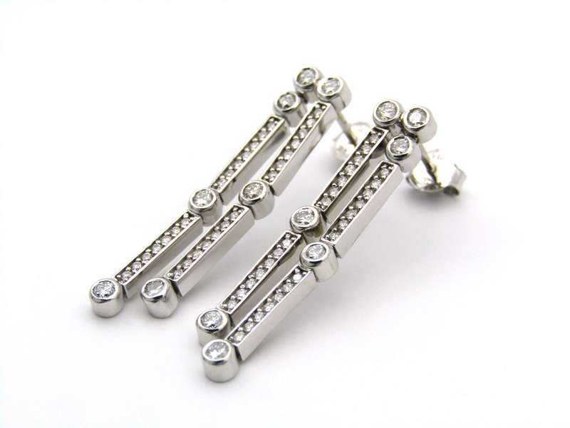 18K gold diamond drop earrings.