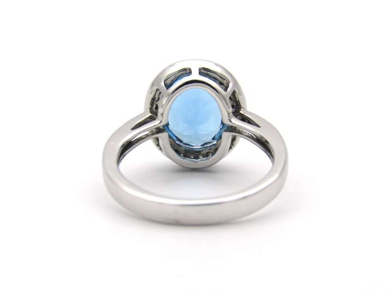 14K gold blue topaz and diamond ring.