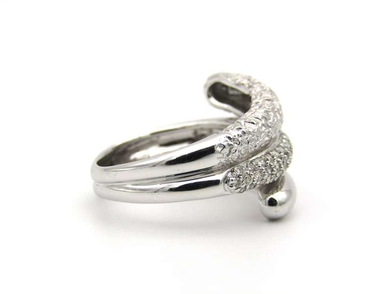 9K gold diamond swirl ring.
