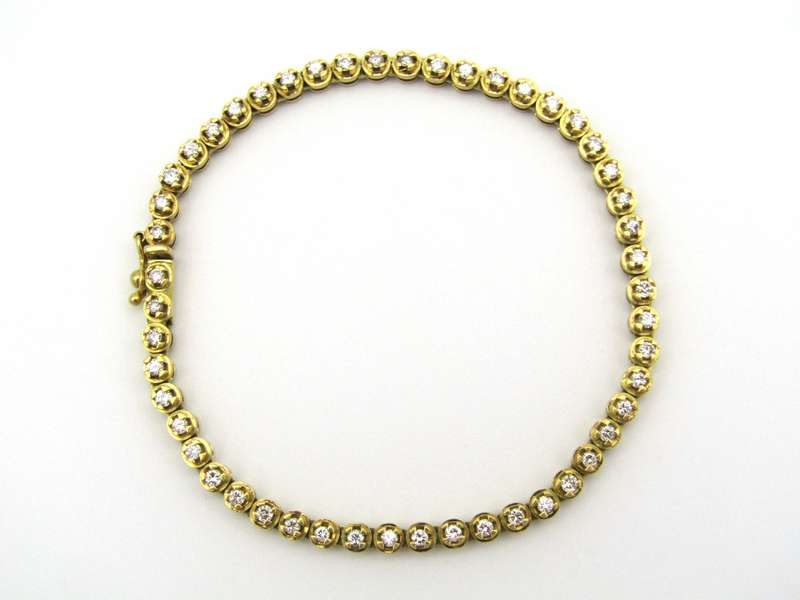 18kt gold diamond tennis bracelet.