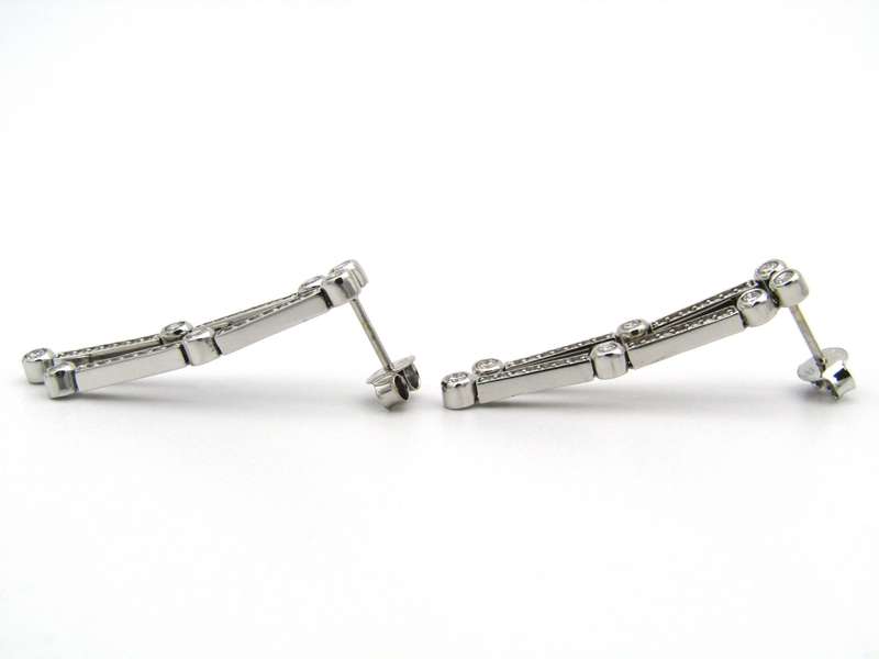 18K gold diamond drop earrings.