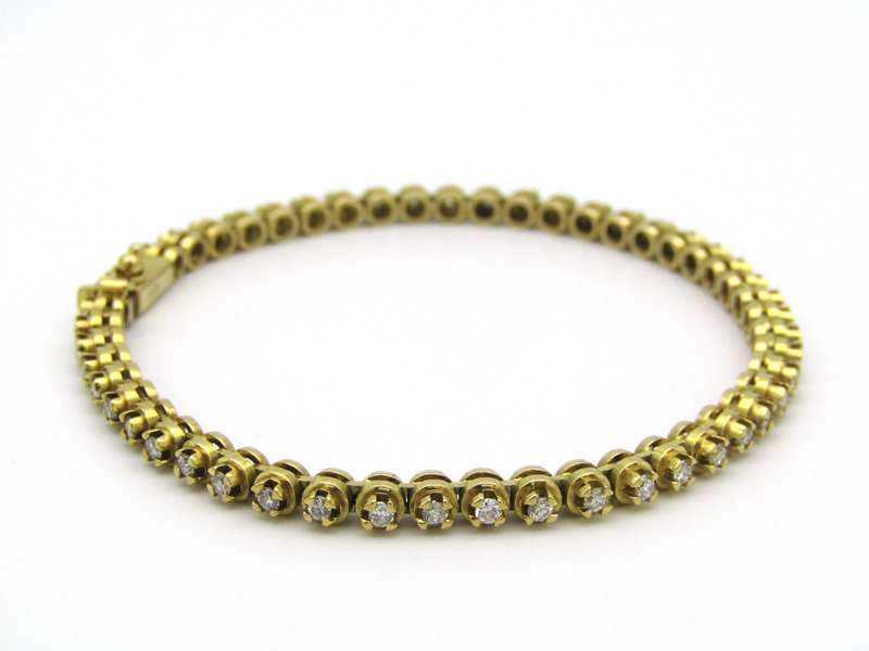 18kt gold diamond tennis bracelet.