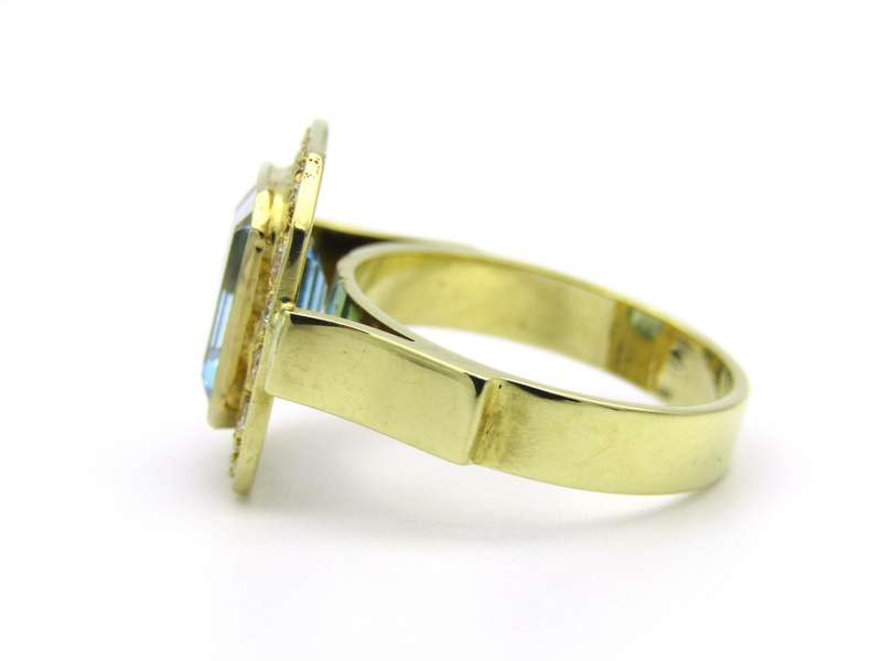 18K gold blue topaz and diamond ring.