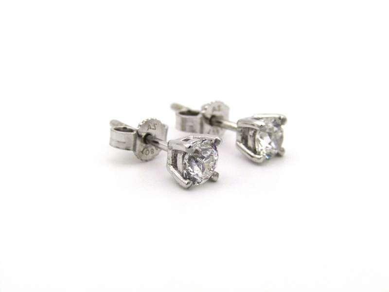 A pair of 18K gold diamond studs.