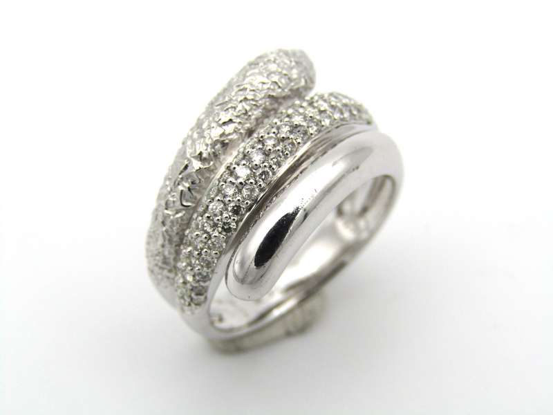 9K gold diamond swirl ring.
