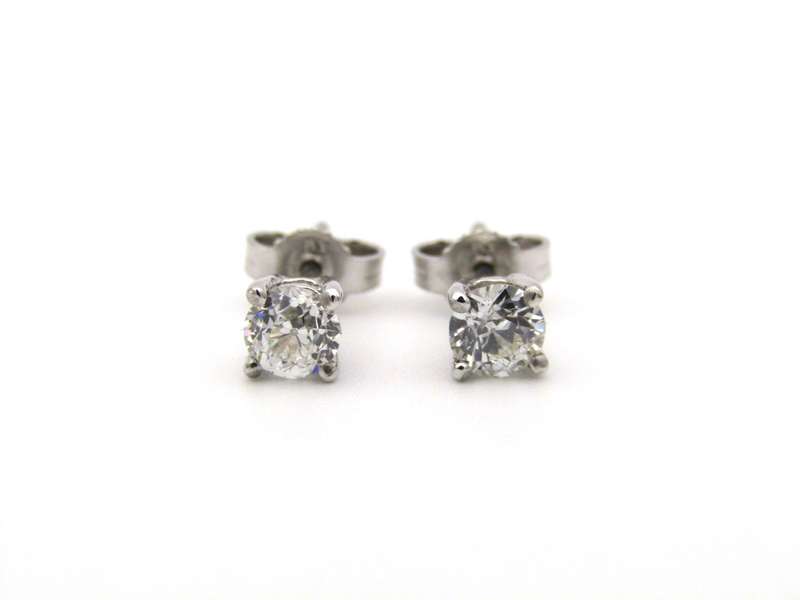 A pair of 18K gold diamond studs.
