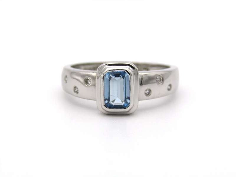 9K gold blue topaz and diamond ring by Browns.