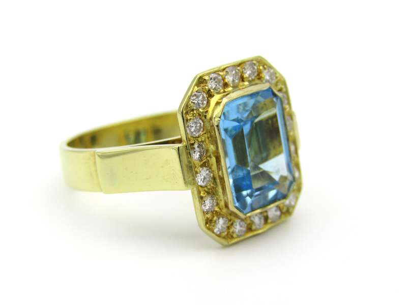 18K gold blue topaz and diamond ring.