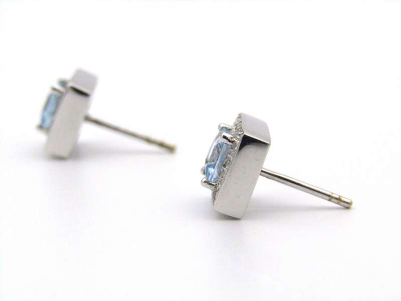 A pair of 18K gold Blue Topaz and diamond earrings.