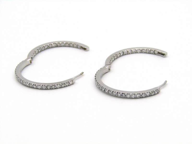 18K gold diamond hoop earrings.