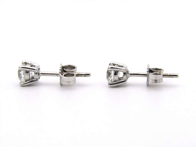 A pair of 18K gold diamond studs.