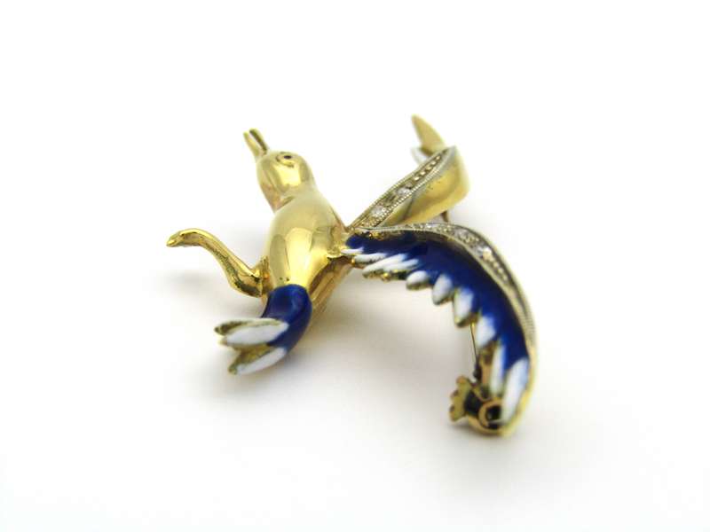 18K gold diamond and enamel "Bird in flight" brooch.
