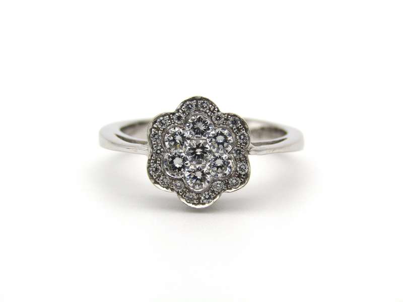 18K gold diamond flower ring.