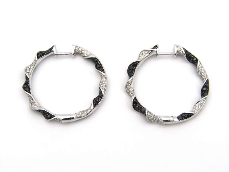 18K gold black and colourless diamond earrings.