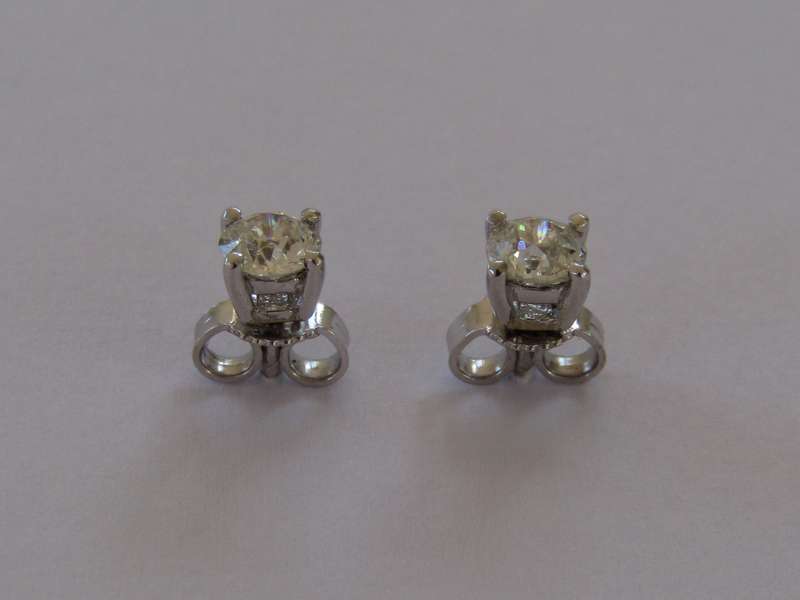 A pair of 18kt gold diamond stud earrings