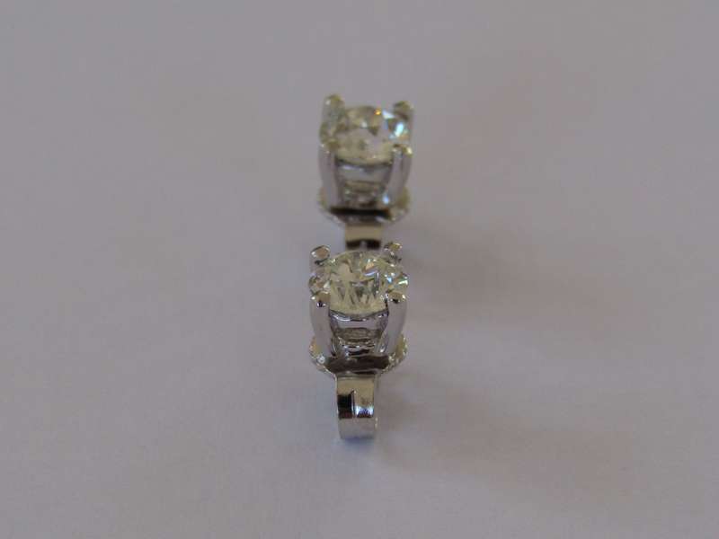 A pair of 18kt gold diamond stud earrings