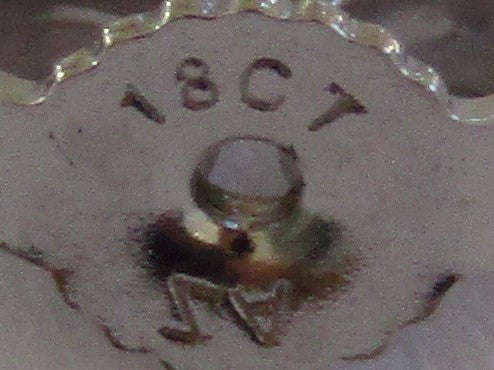 A pair of 18kt gold diamond stud earrings