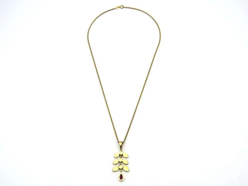A Vintage 9K gold Almandine garnet and diamond pendant.