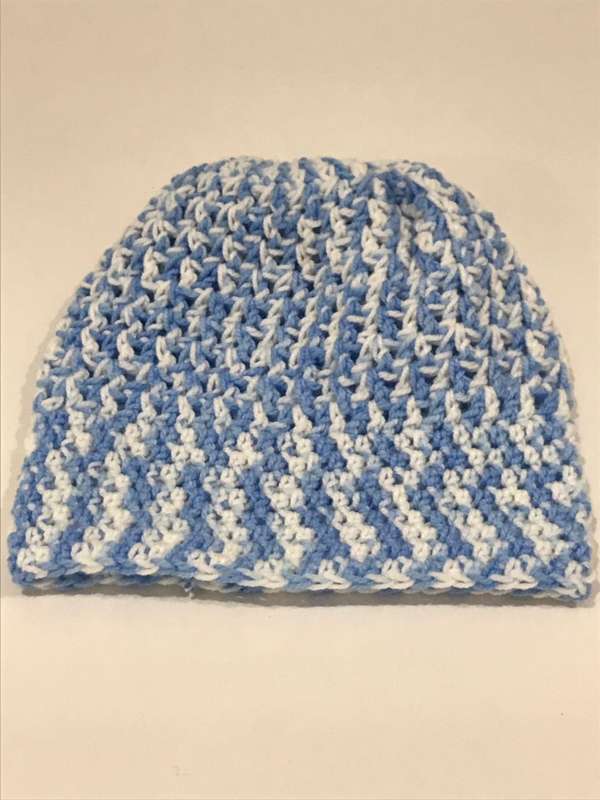 Hand knitted beanie with pony tale hole and boot cuffs