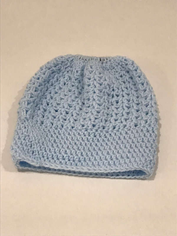 Hand knitted beanie with pony tale hole and boot cuffs