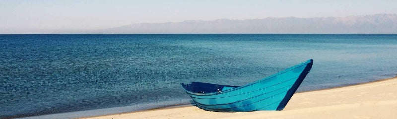Blue Boat on the Beach Poster