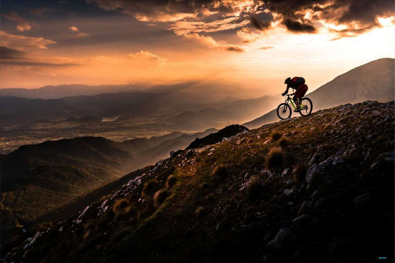Sunset Ride by Sandi Bertoncelj  - Mountain Biking Poster