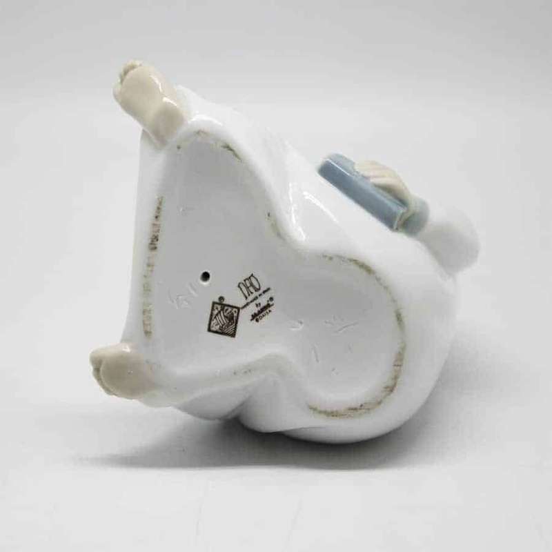 Nao Boy Holding Chamber Stick Figurine