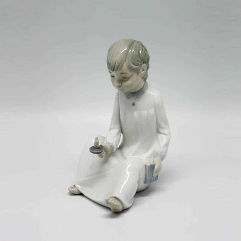 Nao Boy Holding Chamber Stick Figurine