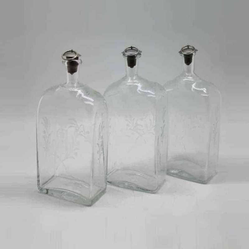 Set of three Glass Decanters with Leather Holder