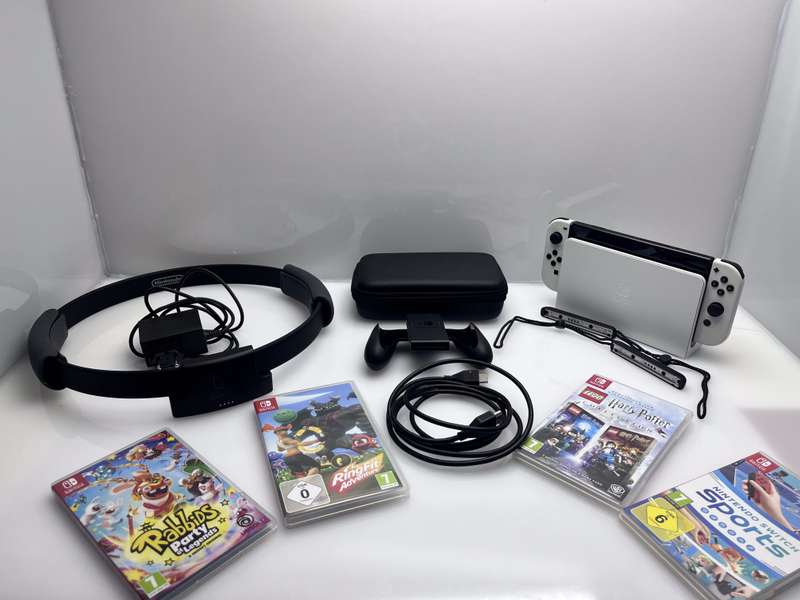 Nintendo Switch OLED 64GB Black + 1 Joy-Con Grip + HDMI &amp; Power Cable + Carry Case + 4 Games