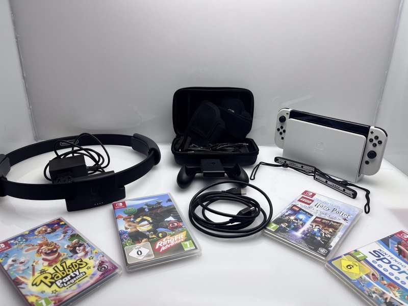 Nintendo Switch OLED 64GB Black + 1 Joy-Con Grip + HDMI &amp; Power Cable + Carry Case + 4 Games