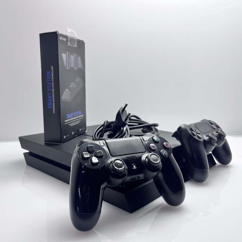 Playstation 4 1TB SSD Black 2 Controllers + Controller Charging Station + HDMI Cable + Power Cabl...