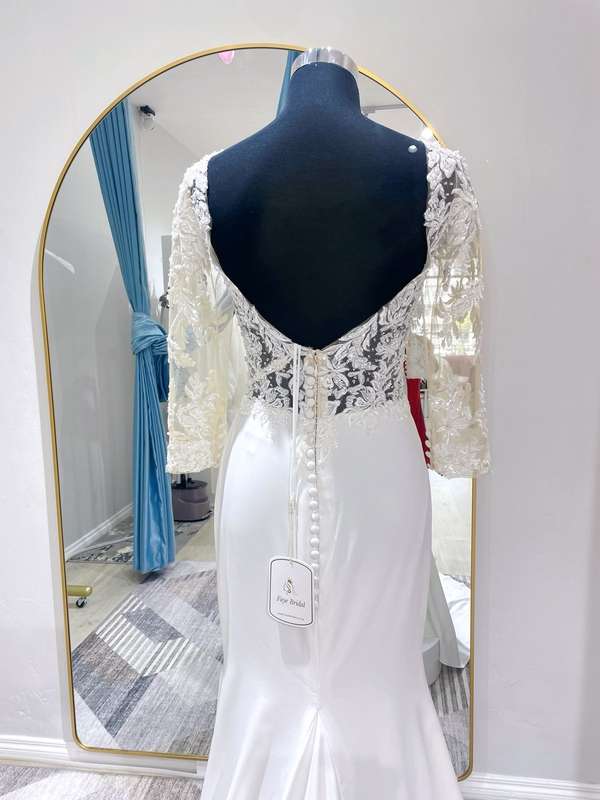Tiara, Crepe Sheath with side slit , lace beaded bodice with sleeves.