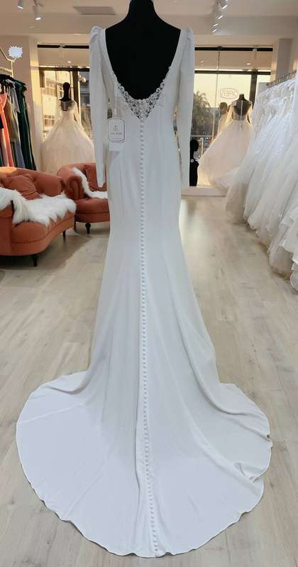 Theressa, Long sleeve low back sheath wedding dress.