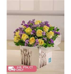 Cream Roses and Purple Filler in Box