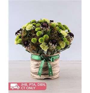Mixed Flowers In Cream Pot