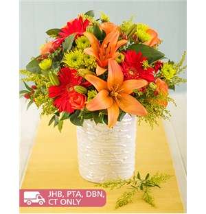 Fiery Mixed Flowers in Glazed Vase