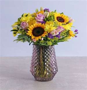 Assorted Classic Flowers In Purple Vase