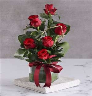 Red Roses In Clear Square Vase