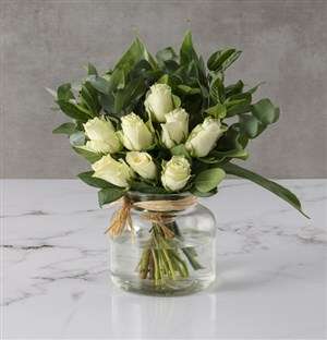 White Roses In Clear Vase