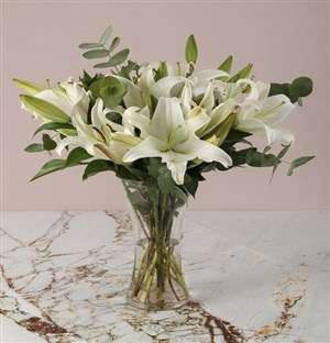 Lustrous Lilies In Vase